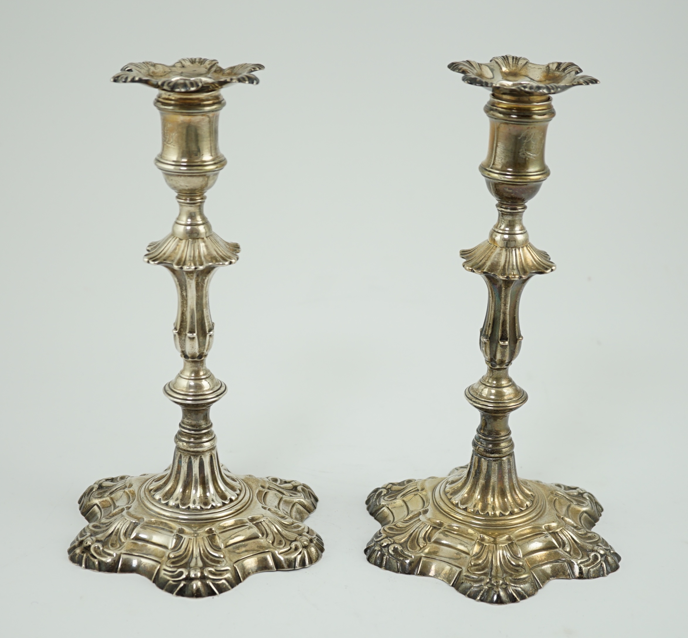 A pair of early George III cast silver candlesticks, by William Cafe